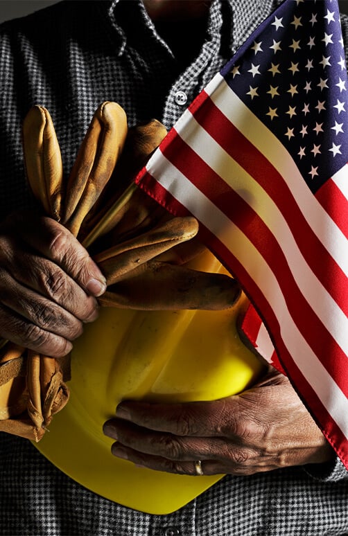 Worker Holding American Flag
